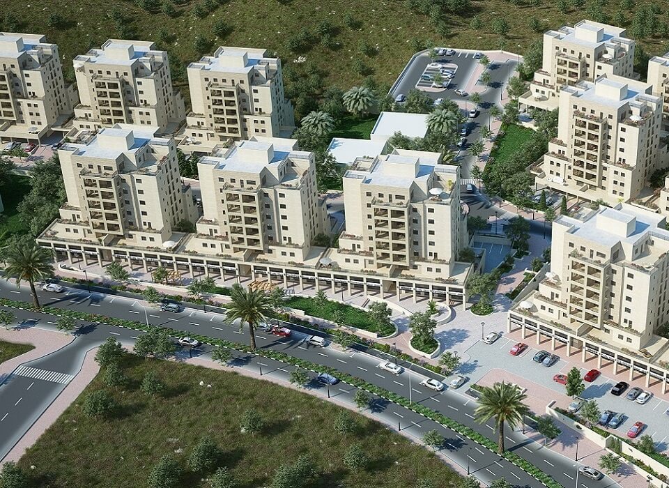 בניינים, כבישים, חניות והרבה דשא ועצים מסביב